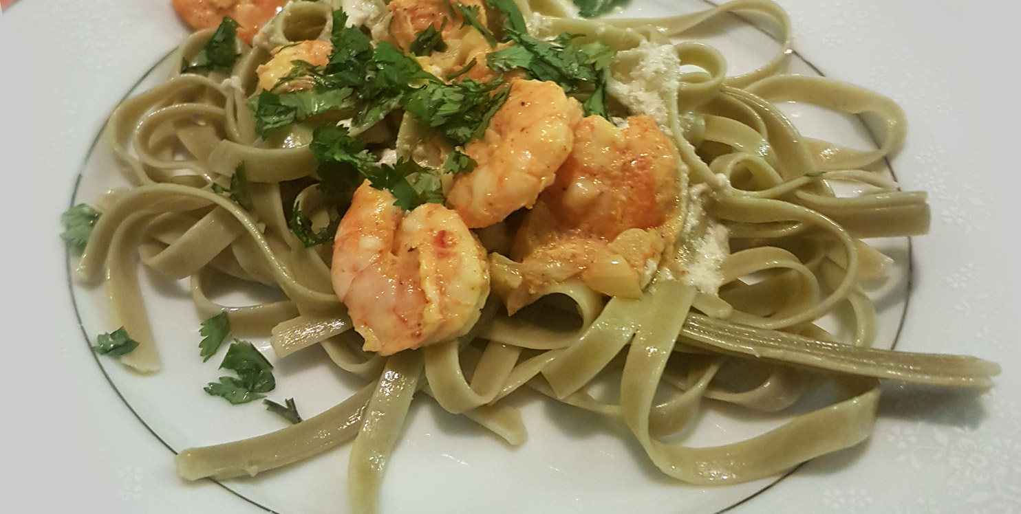 Butter & Garlic Prawns with Spinach Fettuccini and Cheese Sauce